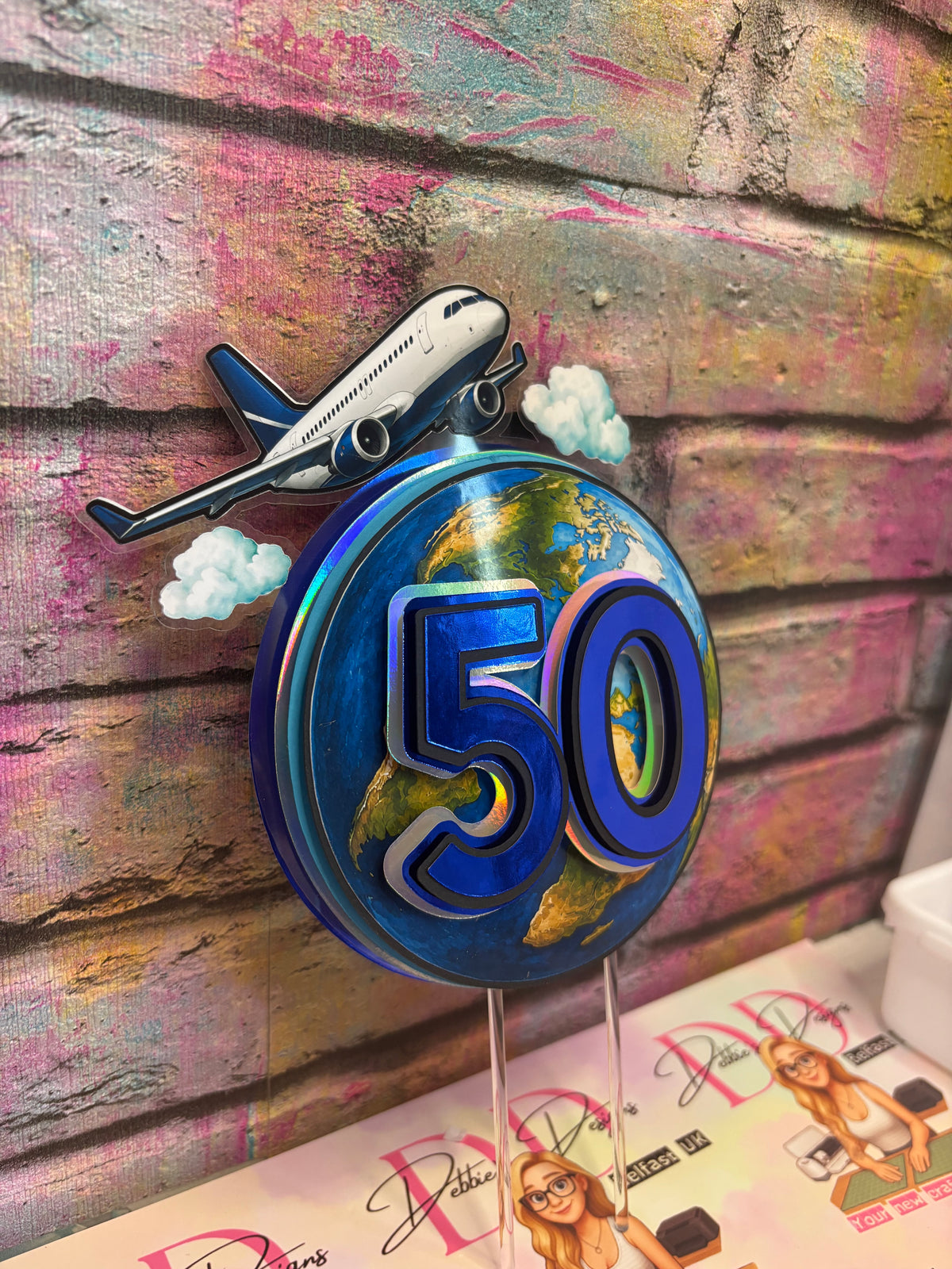 a blue round sign with a plane and earth on it