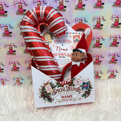 a candy cane in a envelope